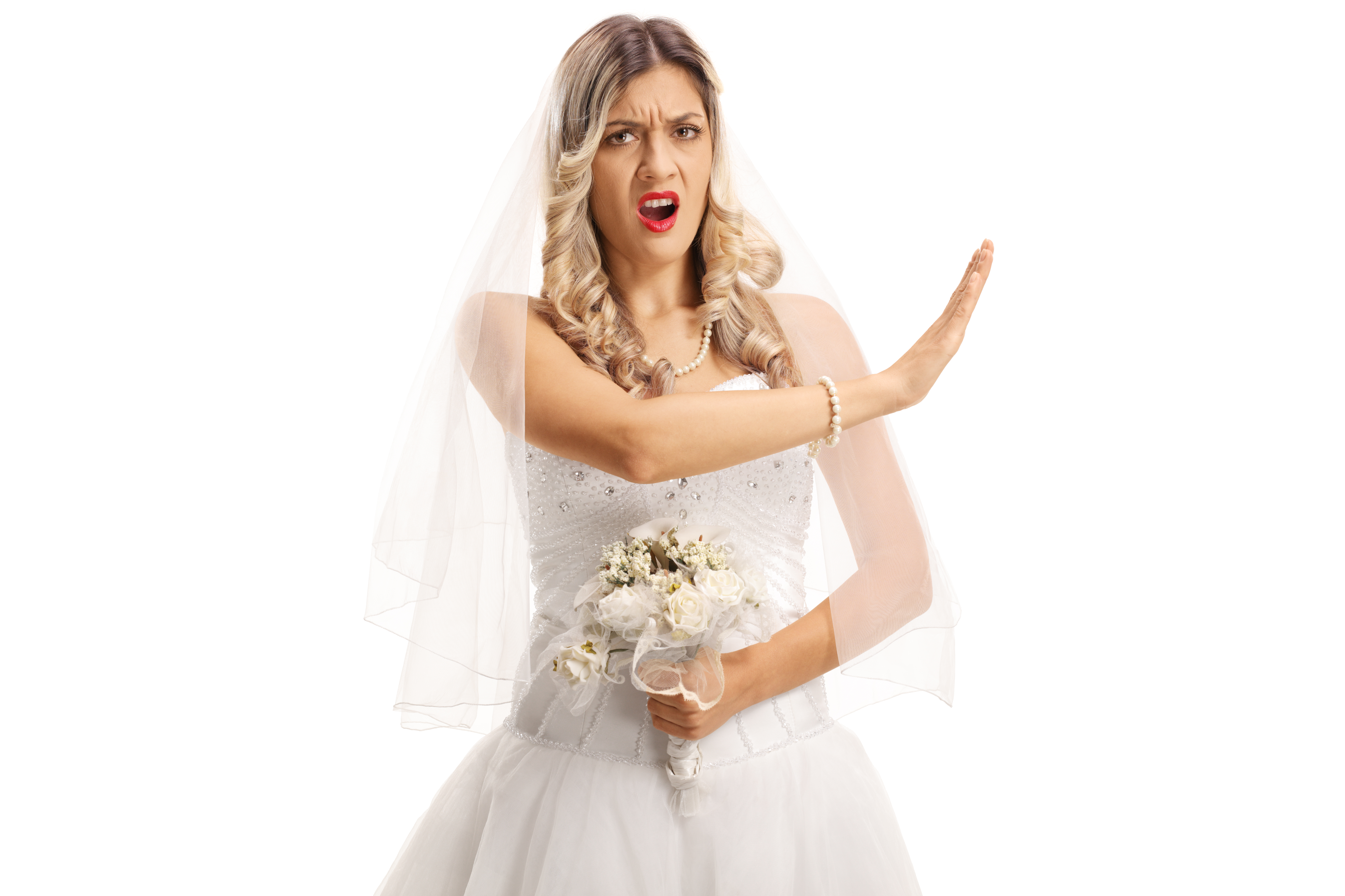 Wściekła panna młoda pokazująca komuś, aby przestał | Źródło: Shutterstock