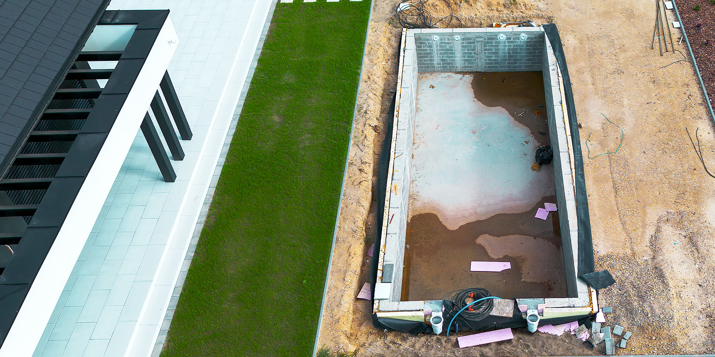 Luftaufnahme einer Schwimmbad-Baustelle | Quelle: Shutterstock